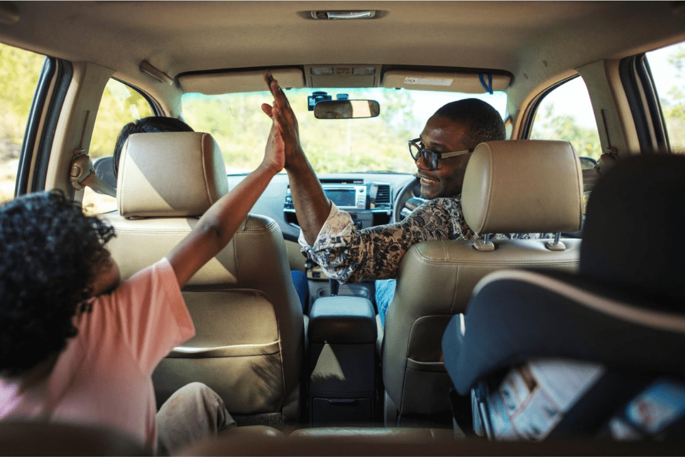 happy family in car going on roadtrip