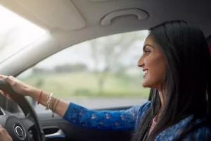 happy woman driving car