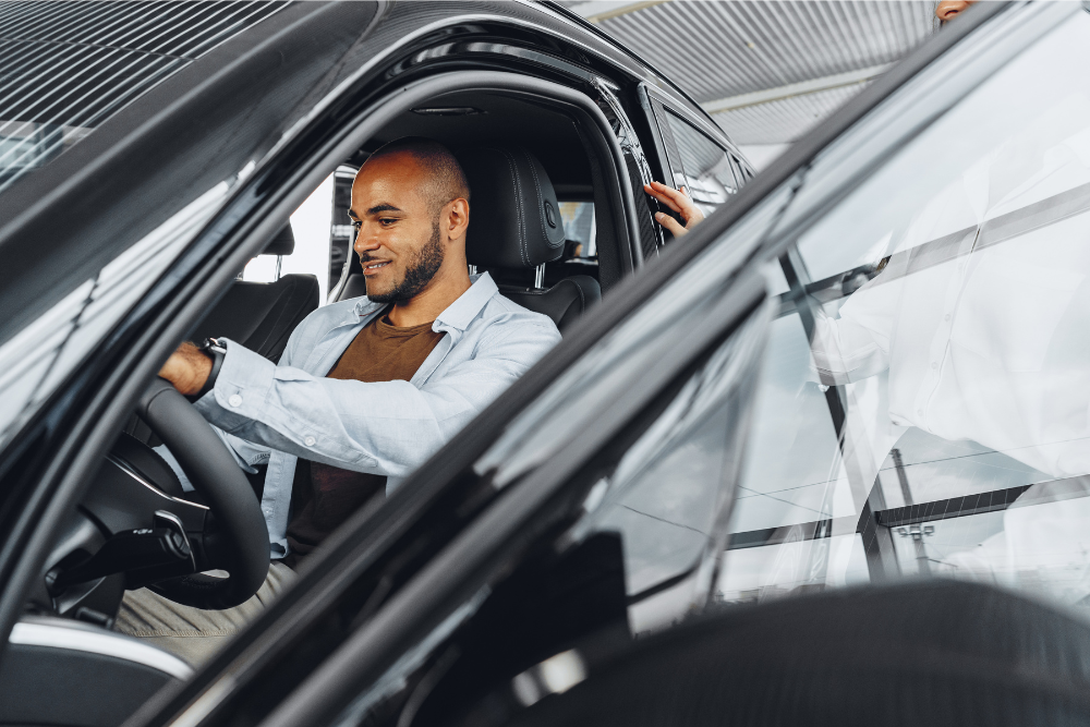 man sitting in ex demo car